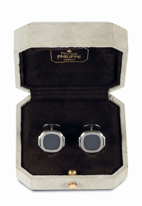 PATEK PHILIPPE, NAUTILUS CUFFLINKS WHITE GOLD. Fine and rare, 18K white gold pair of cufflinks. Accompanied by a fitted box. Made circa 1990. In very good overall condition.
