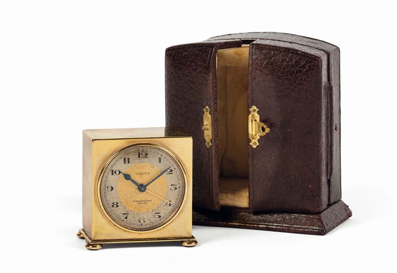 ZENITH, Eberhard Milan, piccolo orologio da viaggio in ottone dorato con funzione di sveglia. Accompagnato dalla scatola originale. Realizzato nel 1930 circa  - Asta Orologi da Polso e da Tasca - Cambi Casa d'Aste