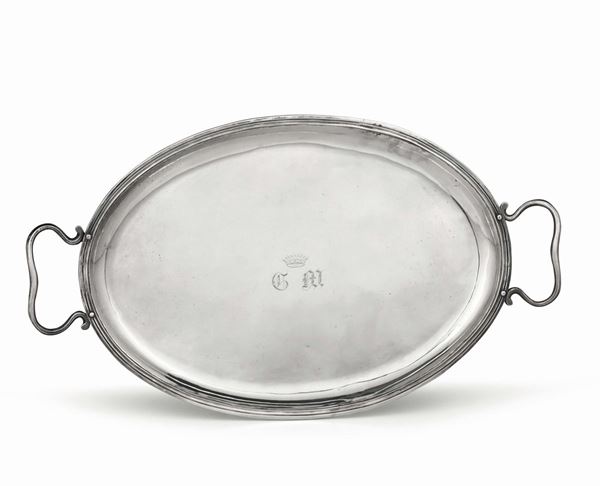 An oval tray in embossed, chiselled and engraved silver, Rome, 19th century, cameral mark in use from 1815 to 1870 (papal tiara and keys).