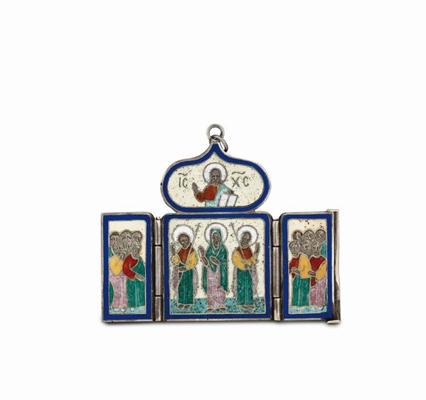 An icon pendant in silver and polychrome enamel, Russia 19-20th century. Title mark and mark for silversmith AH