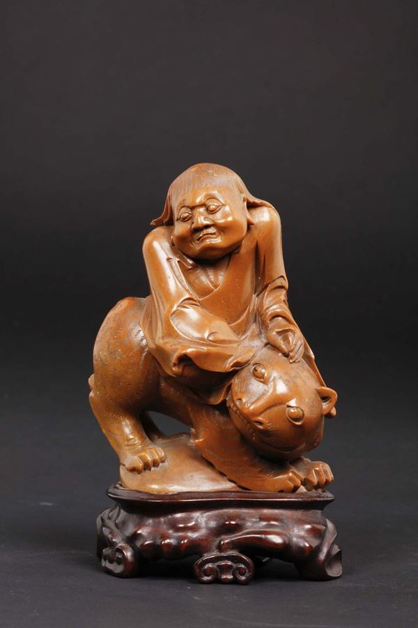 A soapstone figure of wiseman on a panther, China, Qing Dynasty, 19th century