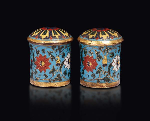 A pair of cloisonné enamel scroll ends with Ming inscription, China, Qing Dynasty, 18th century