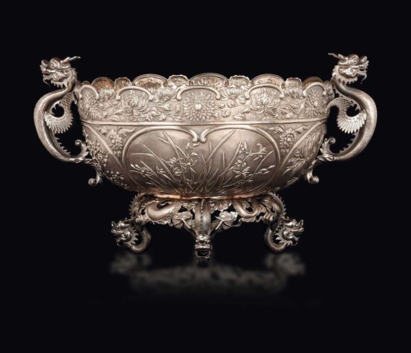 A silver centrepiece with dragon handles and feet, China, early 20th century