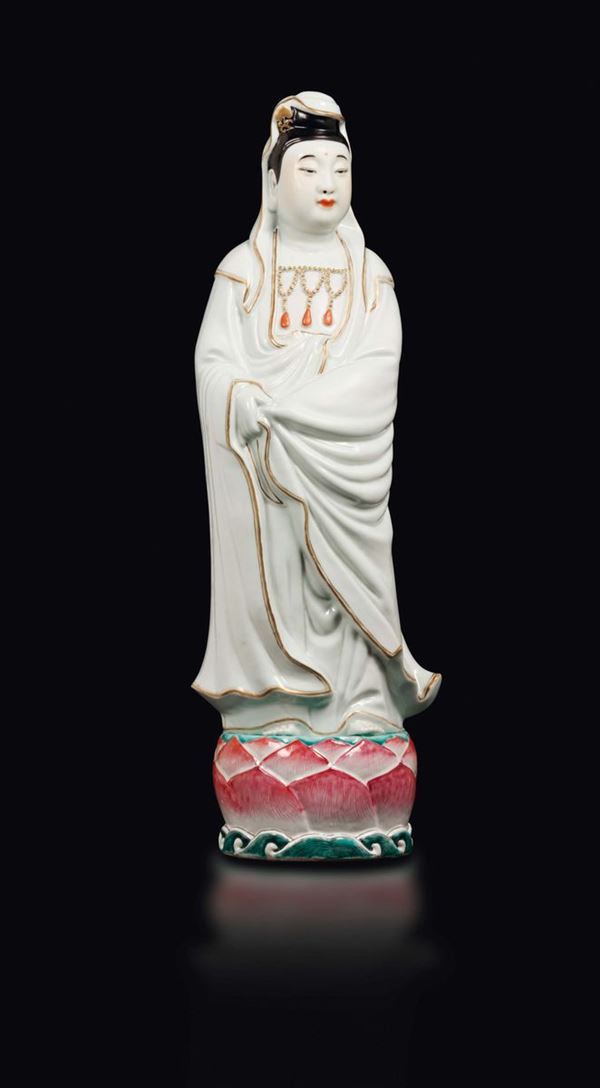 A polychrome enamelled porcelain figure of standing Guanyin on lotus flower, China, Qing Dynasty, 19th century