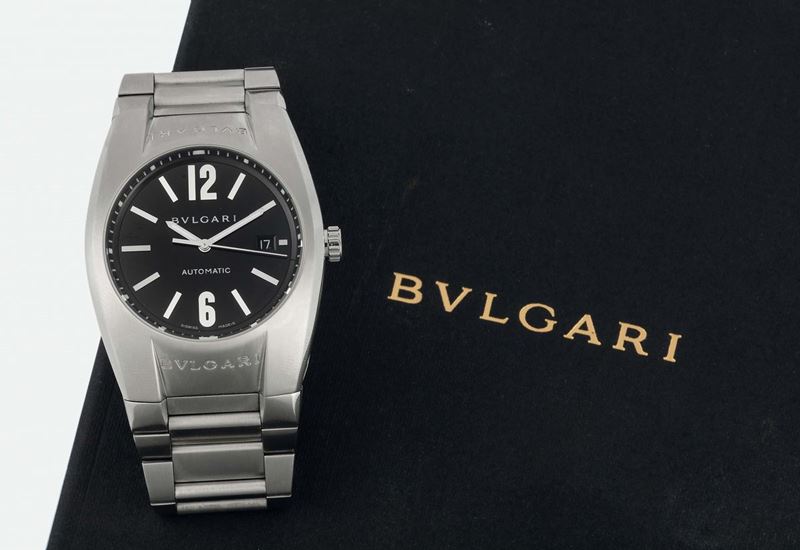 BULGARI, ERGON STEEL  AUTOMATIC, Ref. EG 40 S. Fine, tonneau-shaped, curved, water-resistant, stainless steel wristwatch with date and a stainless steel Bulgari bracelet with double deployant clasp. Accompanied by a box, instructions and Guarantee. Made circa 2004  - Auction Watches and Pocket Watches - Cambi Casa d'Aste