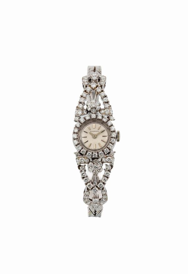 LONGINES, very fine and elegant 18K white gold and diamonds lady's wristwatch with gold bracelet. Made circa 1960