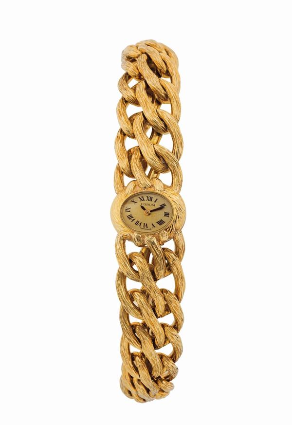 CORUM, elegante orologio da polso, da signora, in oro giallo 18K con bracciale in oro giallo integrato. Realizzato nel 1960 circa