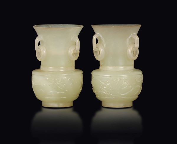 A pair of small white jade vases with ring handles, China, Qing Dynasty, 19th century