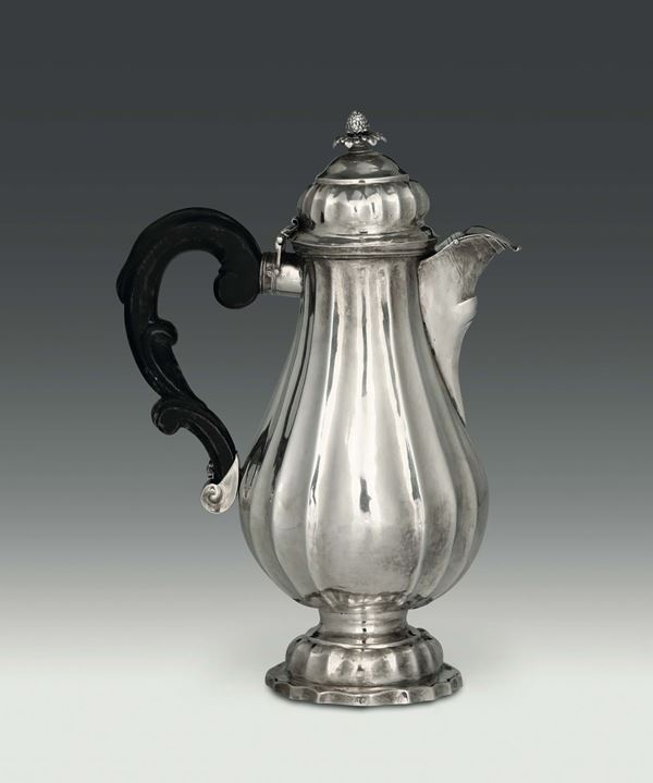 A coffee pot in molten, embossed and chiselled silver. Brescia, second half of the 18th century (cameral stamp before 1777), silversmith Bernardino Lechi, initials BL, no hallmark
