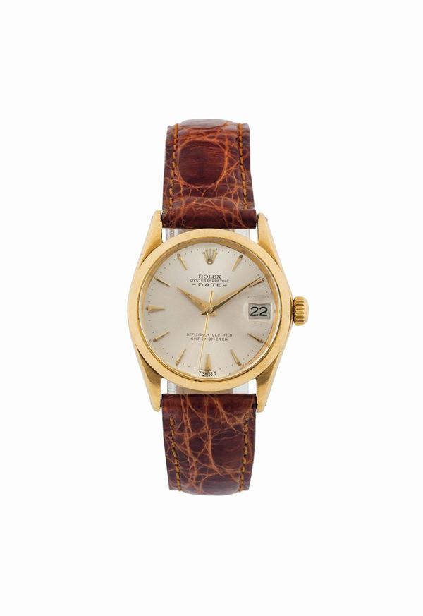 ROLEX, Oyster Perpetual Date, Officially Certified Chronometer, case No. 1146605, Ref. 6626. Fine and rare, tonneau-shaped water-resistant, center seconds, self-winding, 18K yellow gold  wristwatch with date and an original Rolex gold plated buckle. Made circa 1965