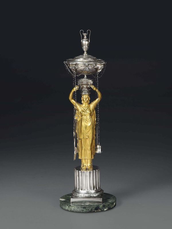 An oil lamp in embossed and chiselled silver, gilt bronze and marble, Rome, first quarter of the 19th century, French guarantee marks and mark for goldsmith (1788 – 1822) in use in his French period between 1811 and 1814.