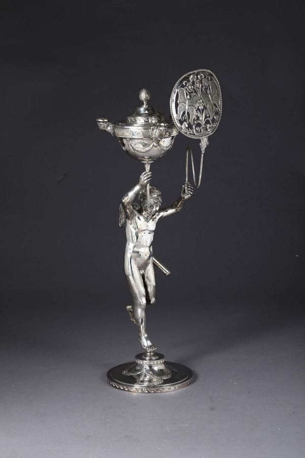 An oil lamp in embossed and chiselled silver, Rome, Roman cameral stamp (in use between 1815 and 1870) and mark for goldsmith Giovacchino Belli (1788 - 1822)