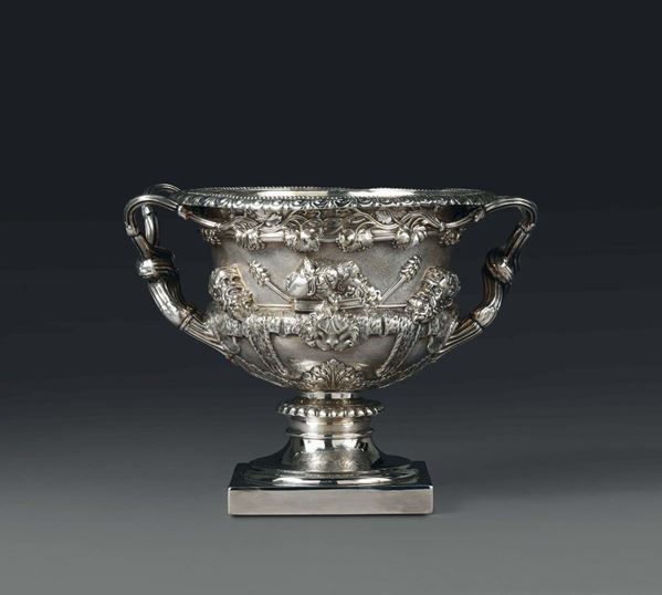 A George III vase in embossed and chiselled silver, England