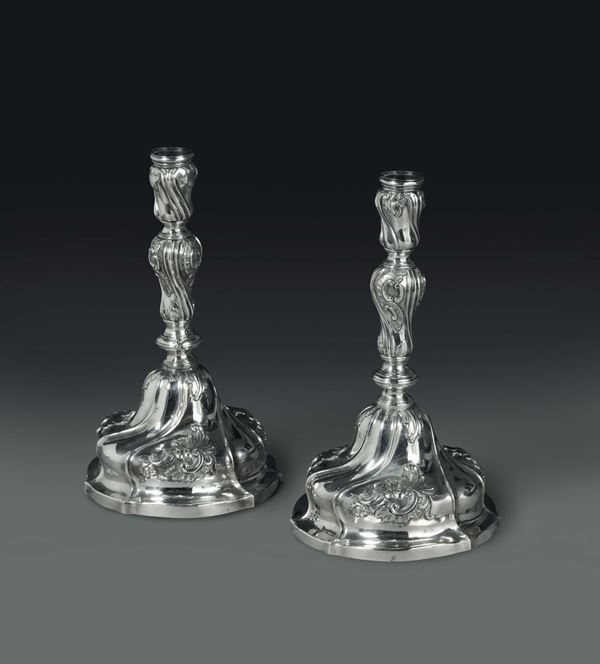 A pair of candle holders in embossed and chiselled silver, Genoa, third quarter of the 18th century, Torretta mark without date