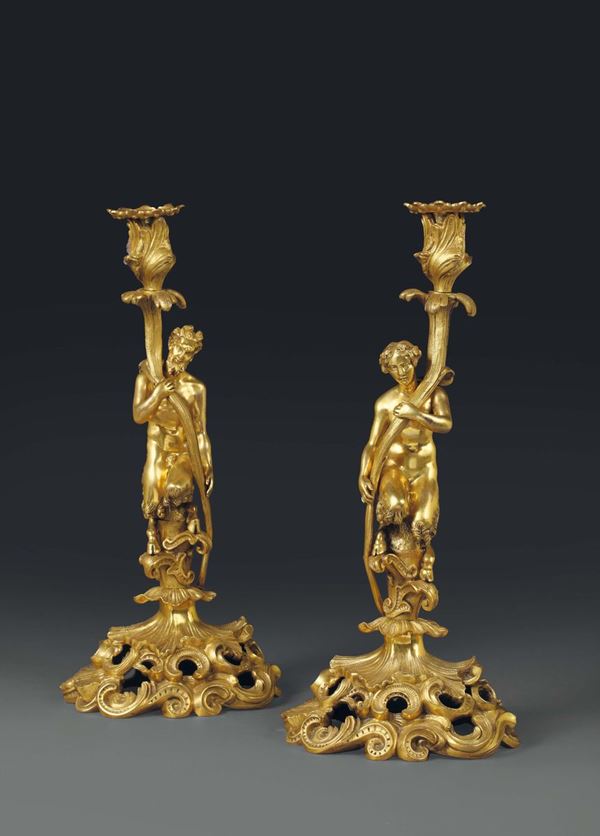 A pair of candle holders in gilt bronze, France 19th century