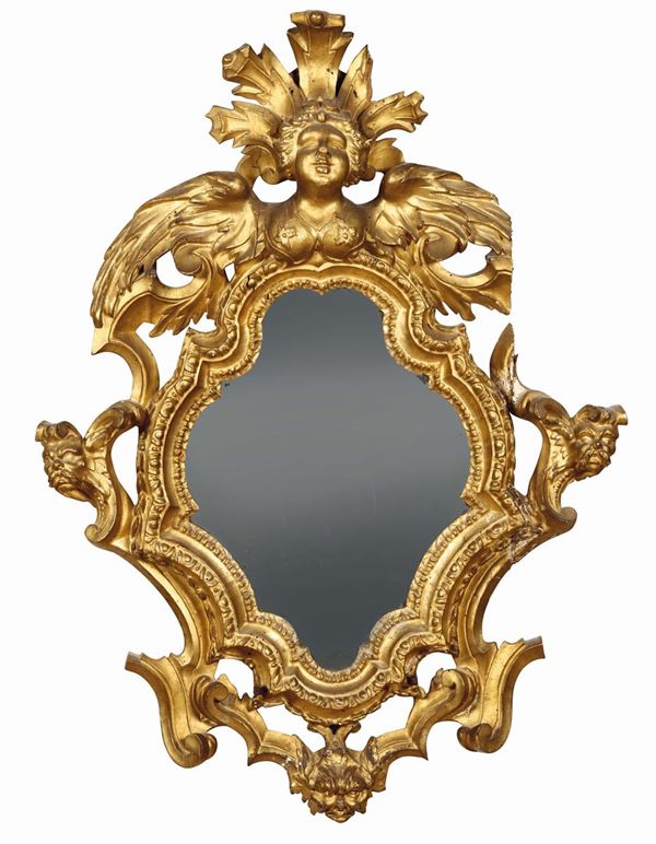 A pair of Louis XV mirrors in carved and gilt wood, Lucca 18th century