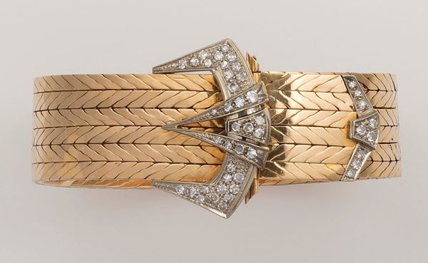 Gold bracelet. Clasp designed as a buckle set with diamonds
