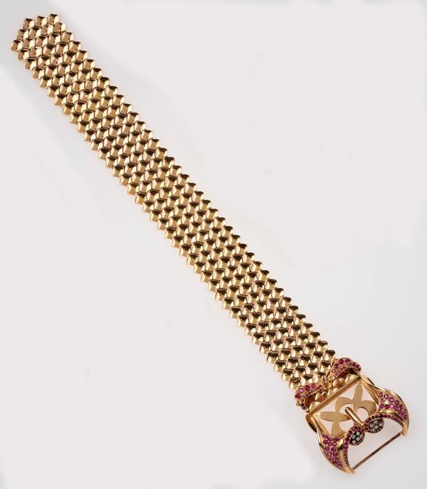 Gold bracelet. Clasp designed as a buckle set with diamonds and rubies