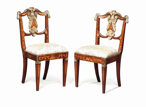 A pair of Directoire chairs in walnut, beginning of the 19th cenutry