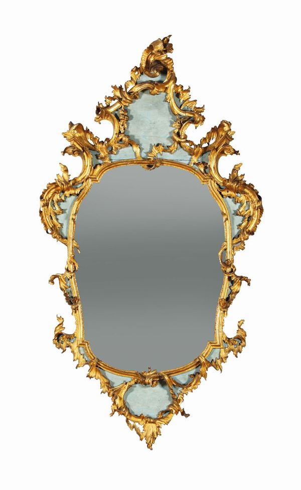 A Louis XV mirror, carved, gilt and lacquered, from the half of the 18th century