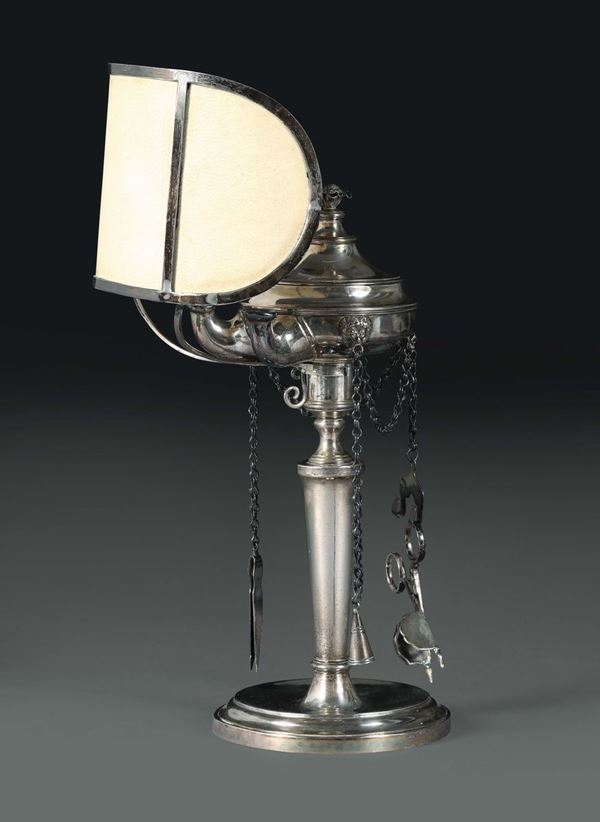 A small oil lamp in molten, embossed and chiselled silver, Venice, 19th century, guarantee marks in use from 1810 on (Ornament and Globe).