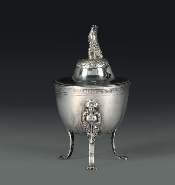A sugar bowl in molten, embossed and chiselled silver, Naples, first half of the 19th century, stamp probably belonging to essayer Paolo De Blasio (1832 - 1835) and mark for silversmith Michele Pane.