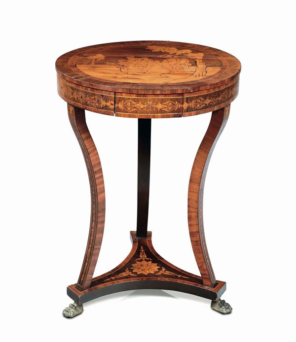A round Empire table, veneered and inlaid, early 19th century