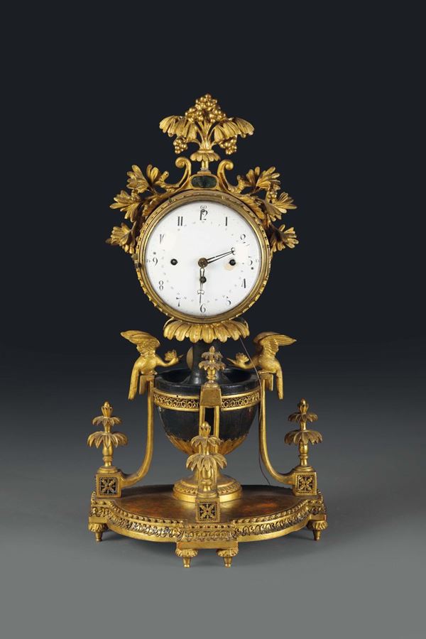 A table pendulum clock in carved and gilt wood, Wien 19th century