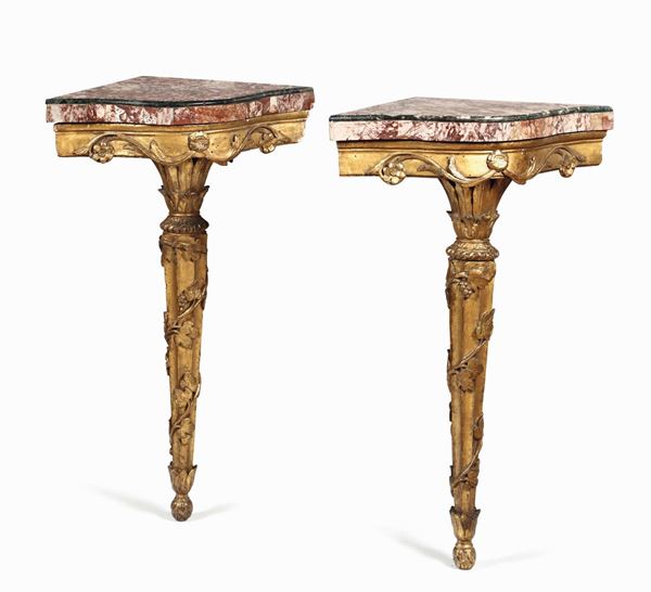 A pair of small Louis XV corner console tables, Genoa end of the 18th century