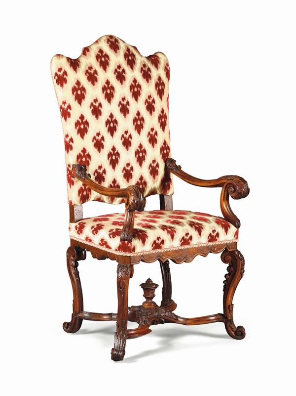 A Louis XIV armchair in richly carved walnut, 18th century
