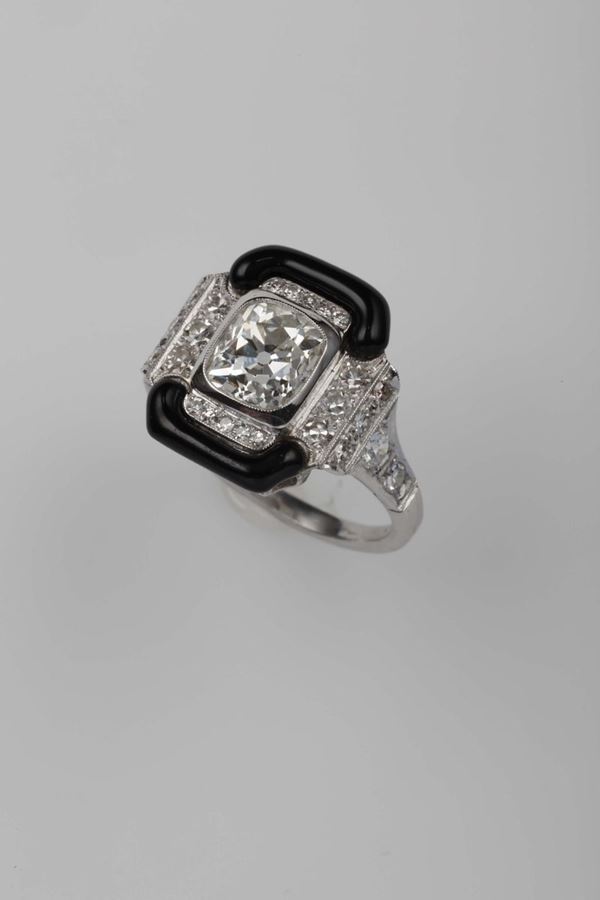 A platinum, diamond and enamel ring by Tiffany N.Y.Black enamel has been used to replace the original, damaged niello