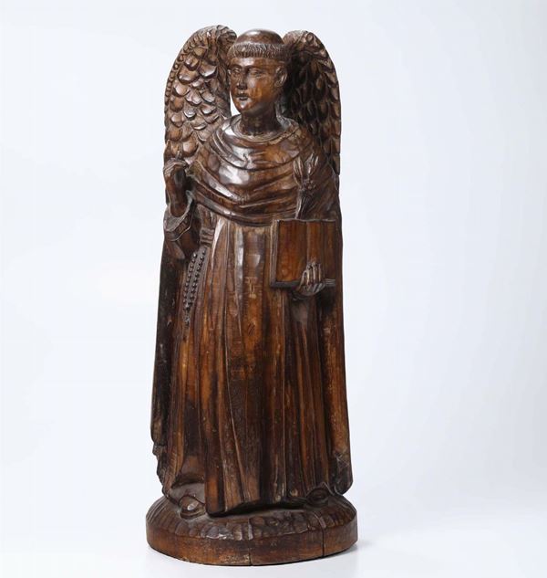 An angel in carved wood, likely from the 15th century
