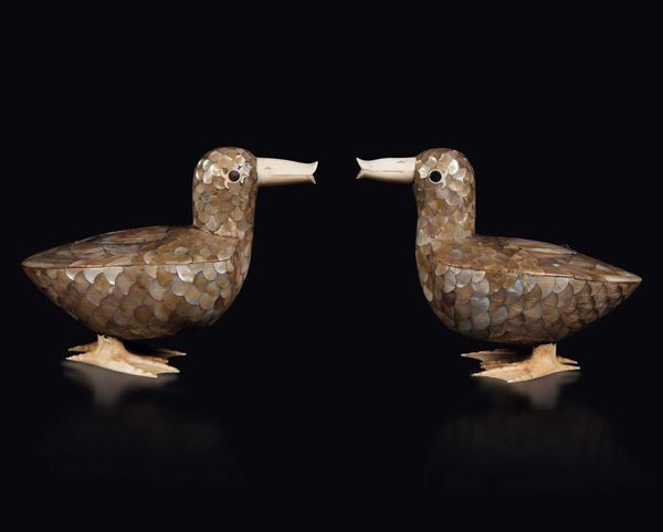A pair of wooden ducks with ivory and mother-of-pearl inlays, China, Qing Dynasty, 19th century