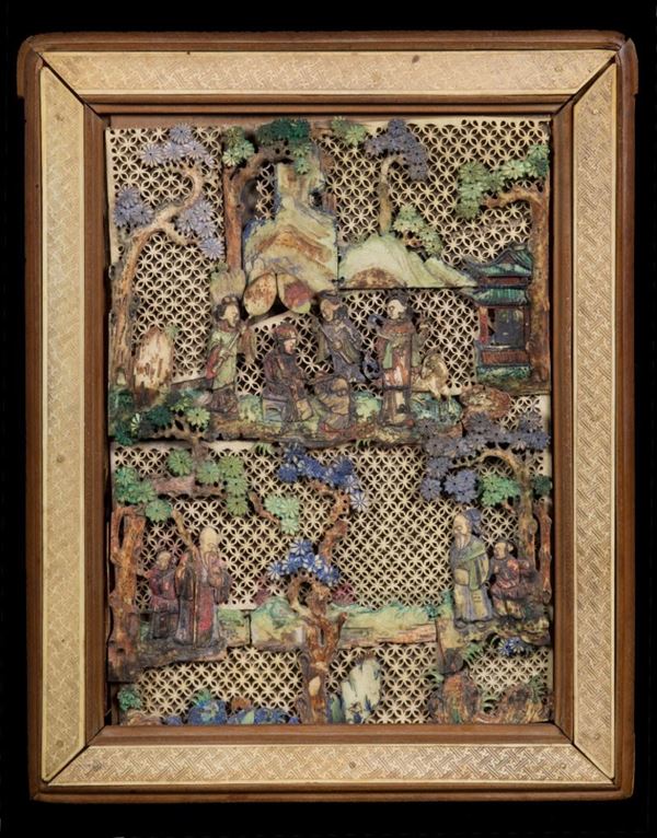A stained ivory panel depicting court life scense, China, Qing Dynasty, 19th century