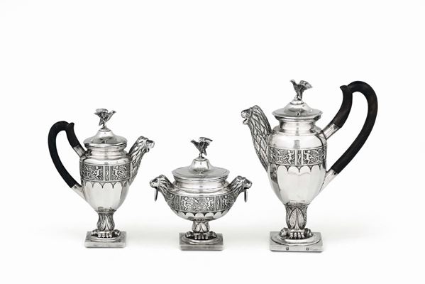 A tea or coffee service in molten, embossed and chiselled silver, Northern Europe (?) 19th century, unidentified title marks and silversmith's mark