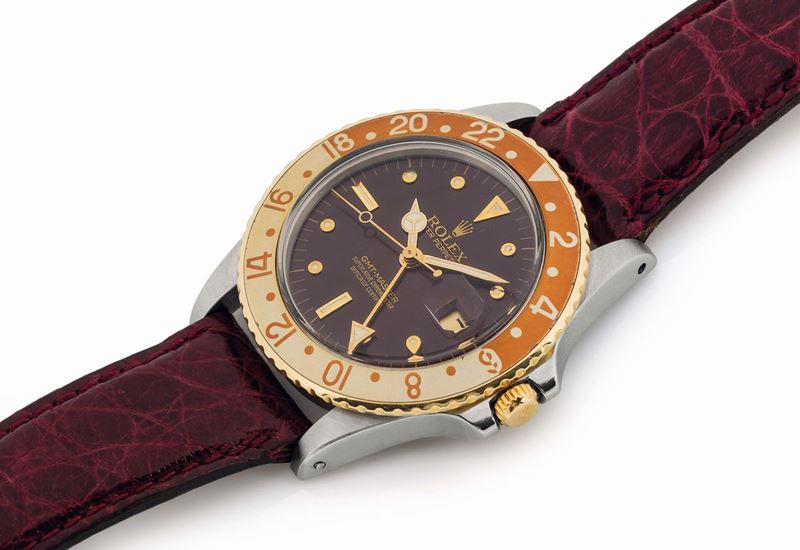 ROLEX, Oyster Perpetual, GMT-Master, Superlative Chronometer, Officially Certified,  case No.6459380, Ref 16753, Nipple Dial. Very fine and rare,  two time zone, center seconds, self-winding, water- resistant, stainless steel and 18K yellow gold Chronometer wristwatch with date, 24-hour bezel and hand with a Rolex steel deployant clasp. Accompanied by a Rolex box. Made circa 1980  - Auction Watches and Pocket Watches - Cambi Casa d'Aste