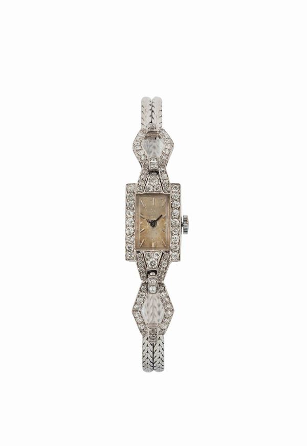 UNIVERSAL GENEVE, 18K white gold lady's wristwatch with gold integrated bracelet. Made circa 1930