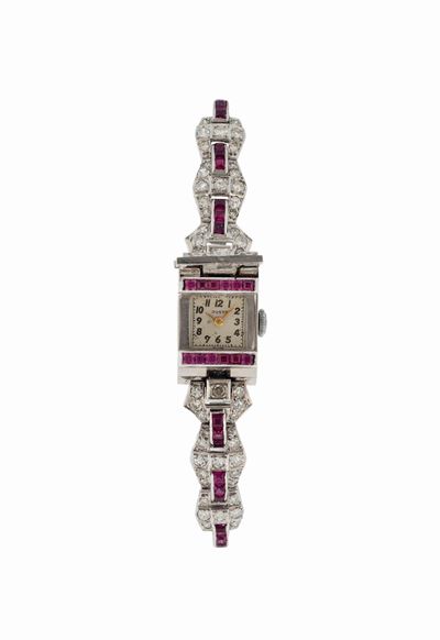 Justa, Orologio da Signora in Platino e Rubini con Bracciale in Oro Bianco 18k. Realizzato nel 19...