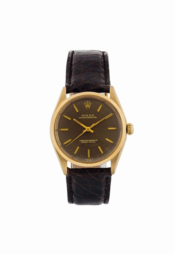ROLEX, Oyster Perpetual, Superlative Chronometer, Officially Certified, case No. 3218553, Ref.1002/1005. Fine, center seconds, self-winding, water-resistant, 18K yellow gold wristwatch with a gold plated Rolex buckle. Made circa 1973