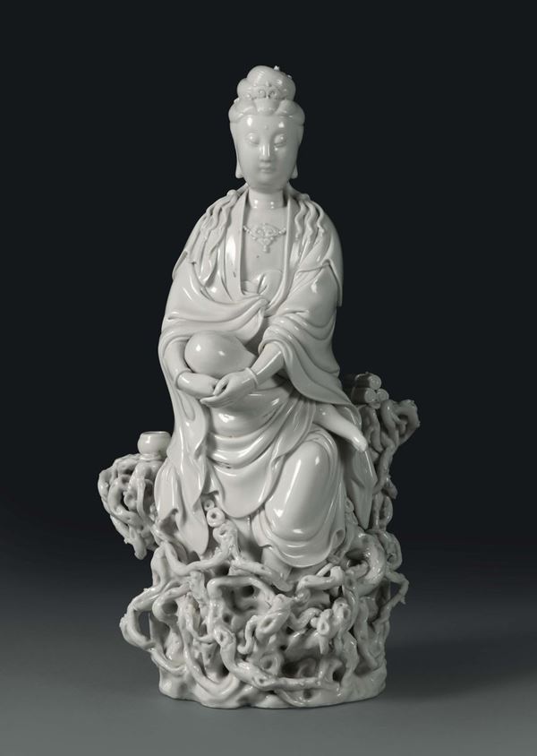 A Guanyin on roots in Blanc de Chine porcelain, China, 20th century