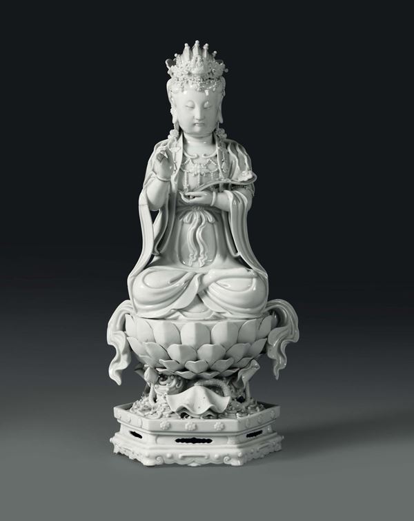 A Guanyin sitting on a lotus flower in Blanc de Chine porcelain, China, Qing dynasty, 19th century