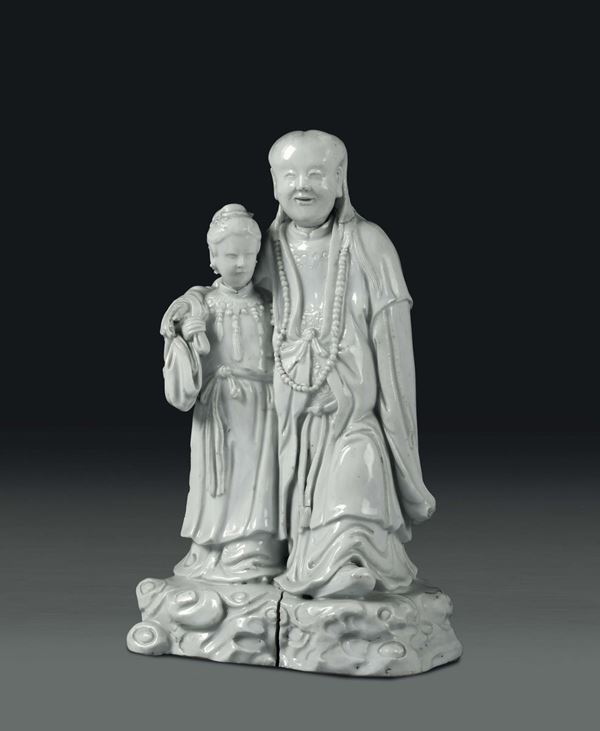 A wiseman with girl in Blanc de Chine porcelain, China, Qing dynasty, 19th century