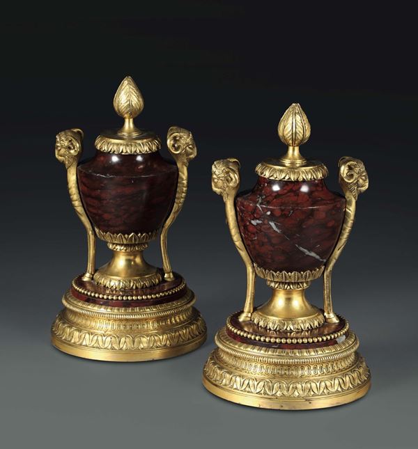 A pair of vases in red marble with rich gilt bronze stands, France 19th century