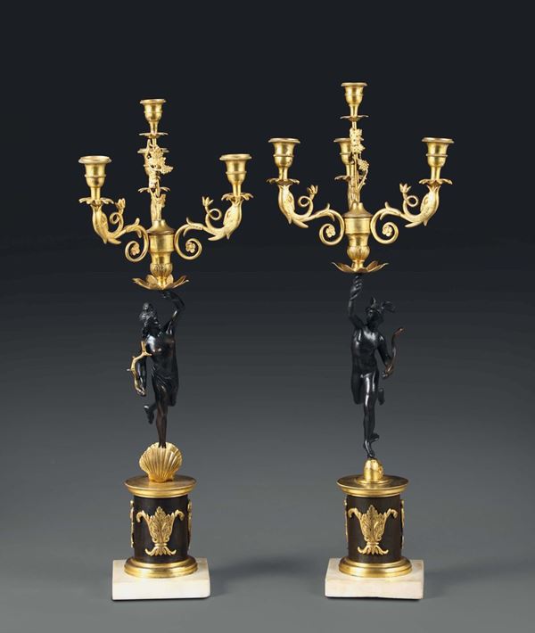 Coppia di candelabri in bronzo a patina scura e dorato a quattro luci, XIX secolo