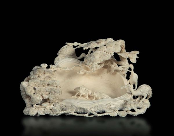 A carved ivory brush washer with cranes and cicada in relief, China, early 20th century