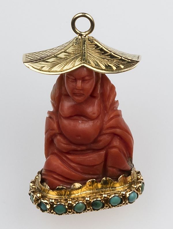 Buddha carved coral, gold and turquoise pendant
