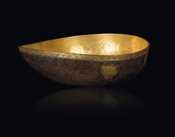 A gilt copper repoussé bowl with floral decoration and carps, China, Qing Dynasty, 18th century