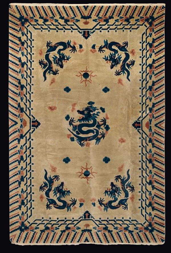 A yellow ground carpet embroidered with blue dragons, China, Qing Dynasty, 19th century