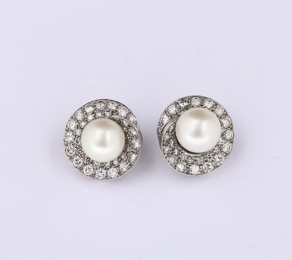 Pair of pearl and diamond earrings. Petochi