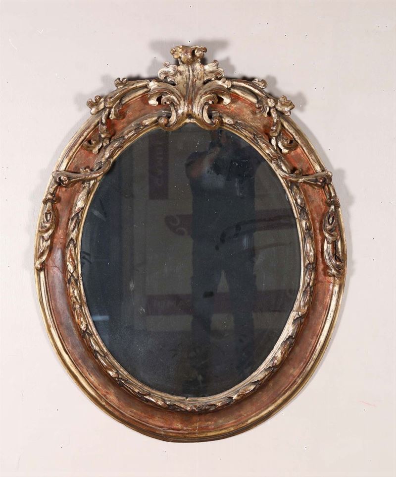 Specchiera ovale laccata e dorata, XIX secolo  - Asta Antiquariato III - Asta a Tempo - Cambi Casa d'Aste